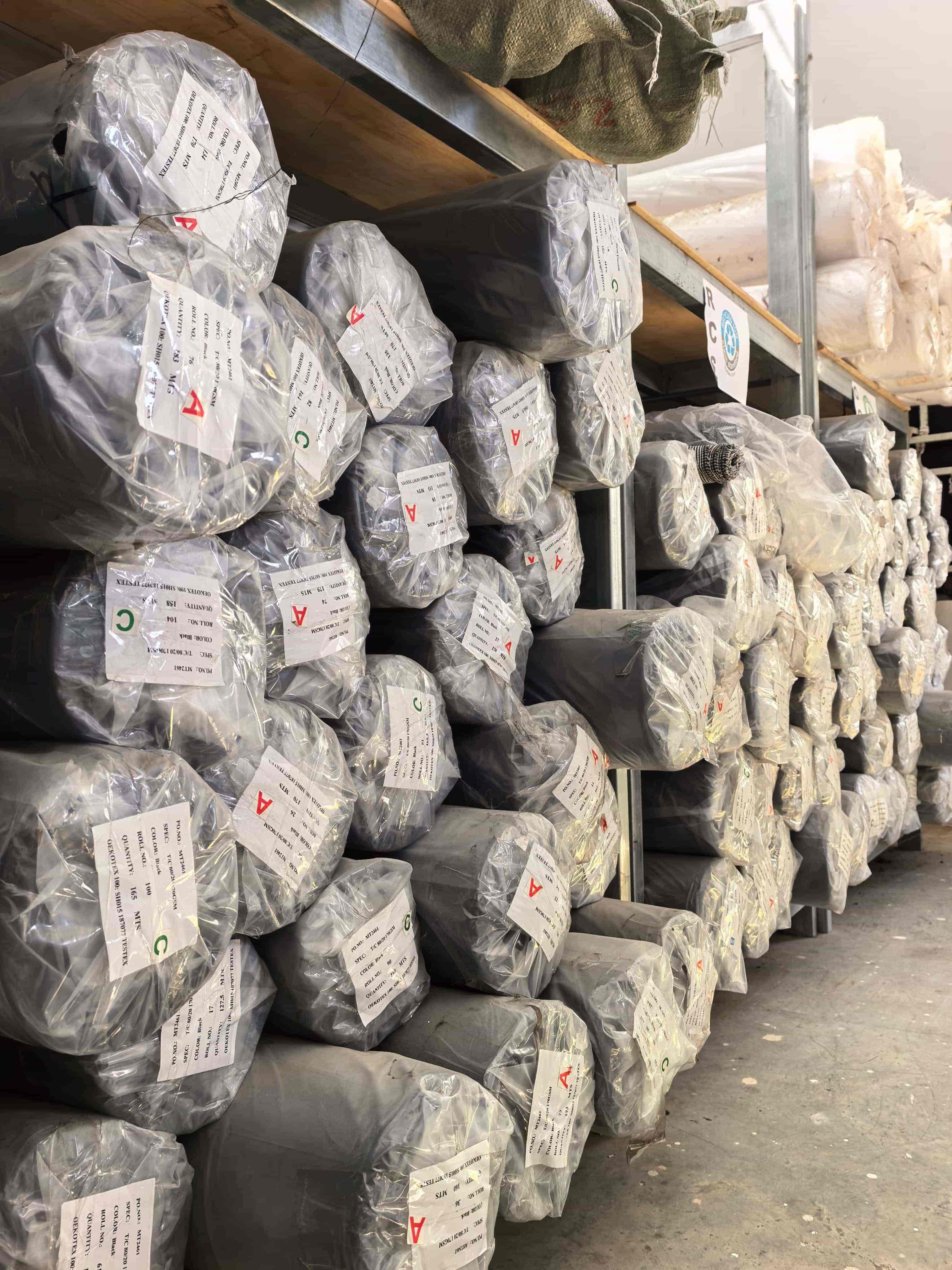 Fabric rolls stored for apparel production programs